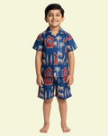 Child wearing a blue pajama set with animal patterns on a beige background, featuring text 'Kids Cord Sets' and '10% off'.

