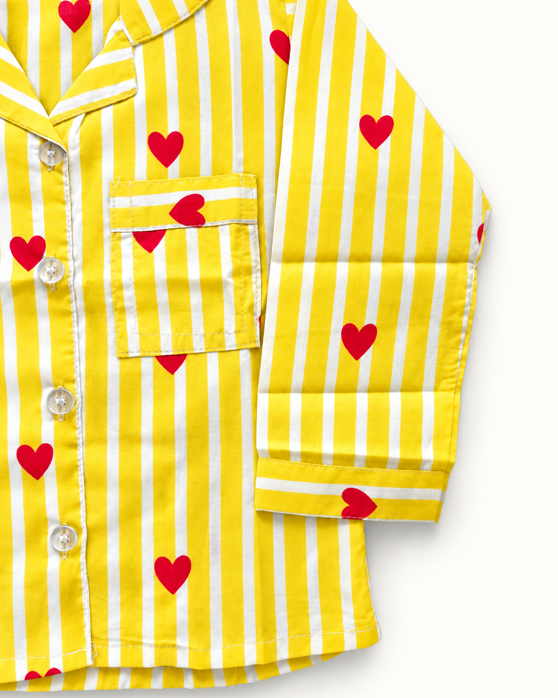 Yellow and white striped pajama shirt with red heart prints, featuring a button-down front and a chest pocket.