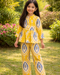 A girl s wearing SnugBug graphic printed, Pure Cotton Co-ord Set in yellow color