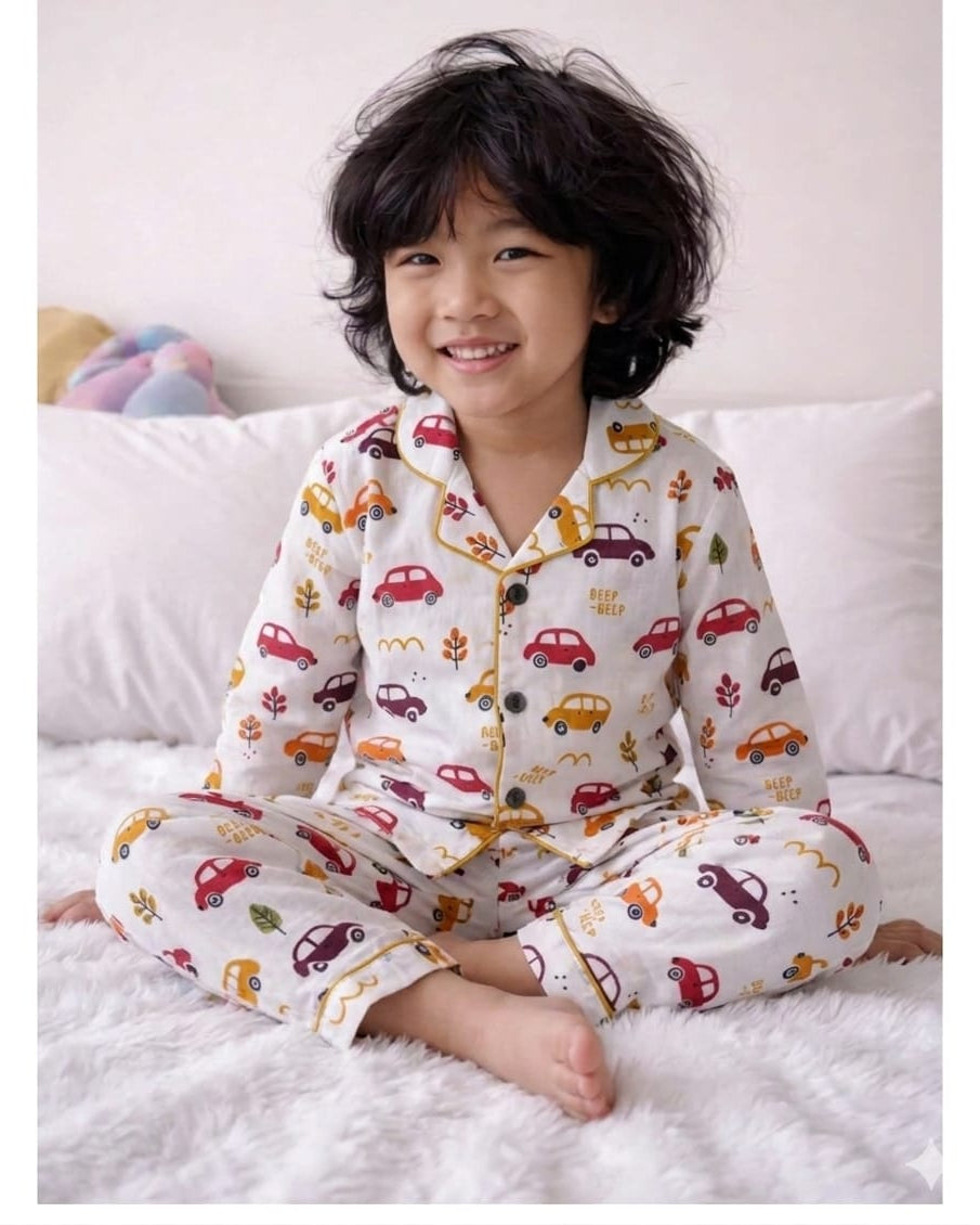 A toddler wearing car print white full sleeve pure cotton night suit set