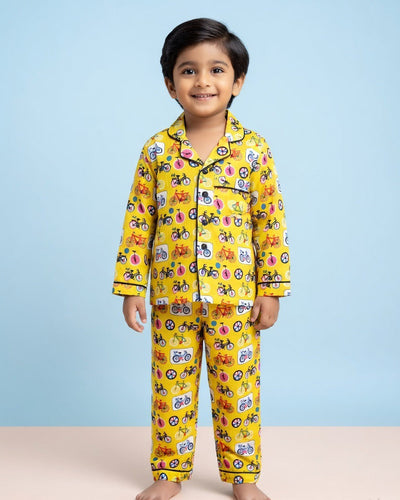 A boy wearing cycle print Pure cotton Yellow Night Suit 